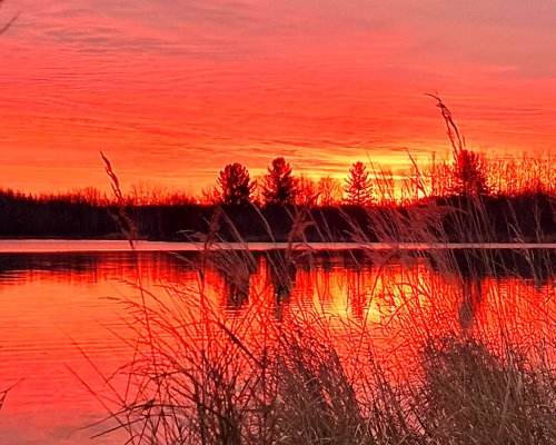 Beautiful sunset over Deer Lake at Deer Lake Farmstead RV Park, Malmo, MN